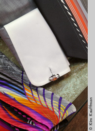 detail photo of cufflinks and cuff by photographer kim kauffman for retail clothing store ad